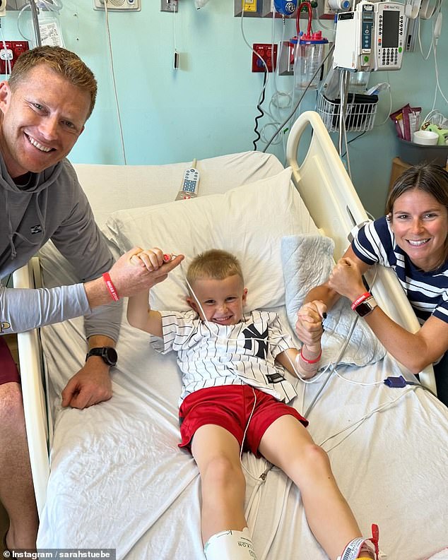 Oscar's mother Sarah Stuebe (right) gave him CPR on the field and saved his life after his father Riley (left) called for her