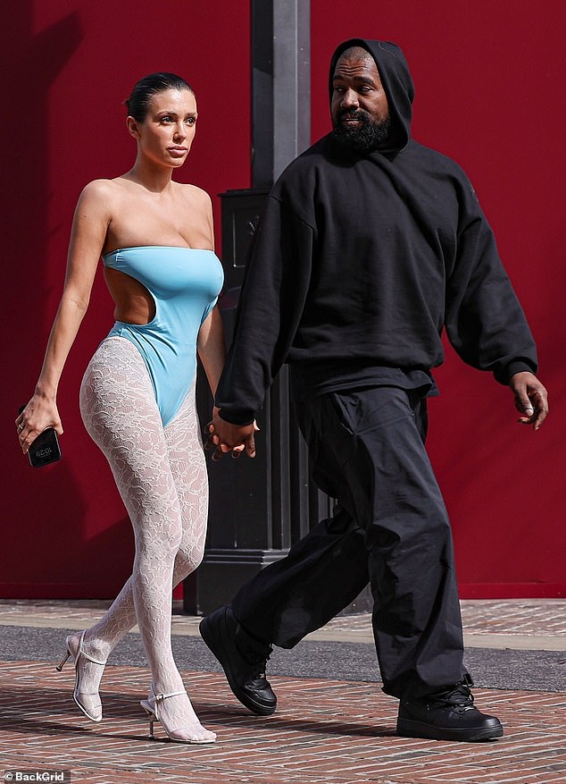 For his part, the Yeezy designer wore an all-black outfit consisting of a hooded sweatshirt over a T-shirt.