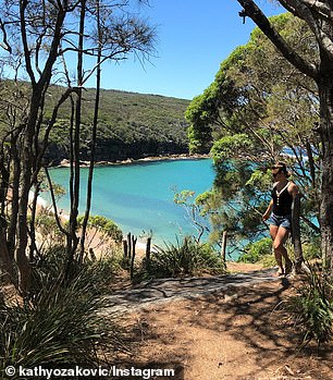 Pristine golden sand contrasts with the deep blue and calm ocean, lined with lush forests and cabbage palms