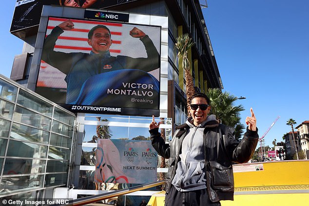 Montalvo poses with his sign on the Sunset Strip during the Team USA Road to Paris Bus Tour