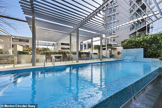 His apartment building has a swimming pool (pictured), a gym and is located on Sydney Harbour