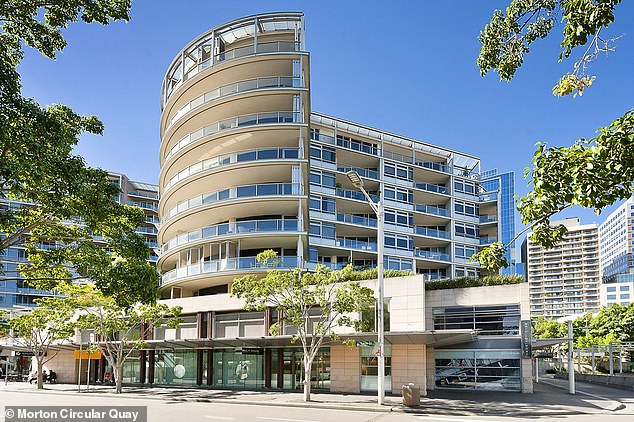 In the photo: the apartment building where Russell Manser was found 'unconscious' on Saturday evening