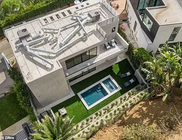 The exterior of 9291 Flicker Way, one of the homes affected by the landslide.  The mansion sold for $3.5 million and was built right on the hill where the landslide occurred