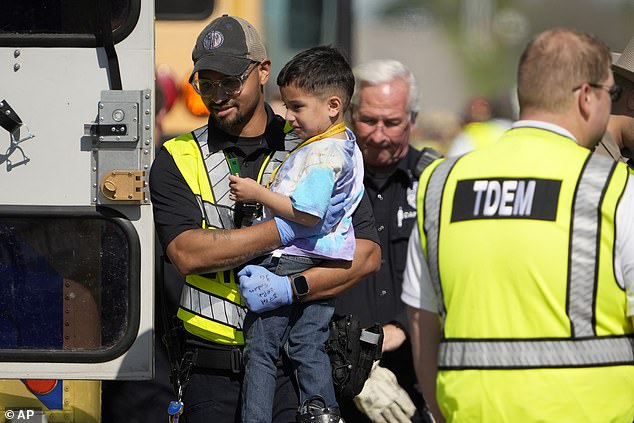 A pre-Ke-er is taken from the scene of the accident by an emergency worker