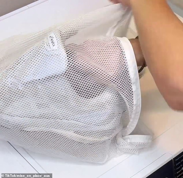 Place your sneakers in a delicate laundry bag before putting them in the washing machine