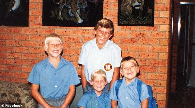 Fanning (pictured below center) took to Instagram and shared an old family photo of himself with his brothers Peter, Edward and Sean after learning of Peter's death just hours before he bravely competed in Hawaii in December 2015.