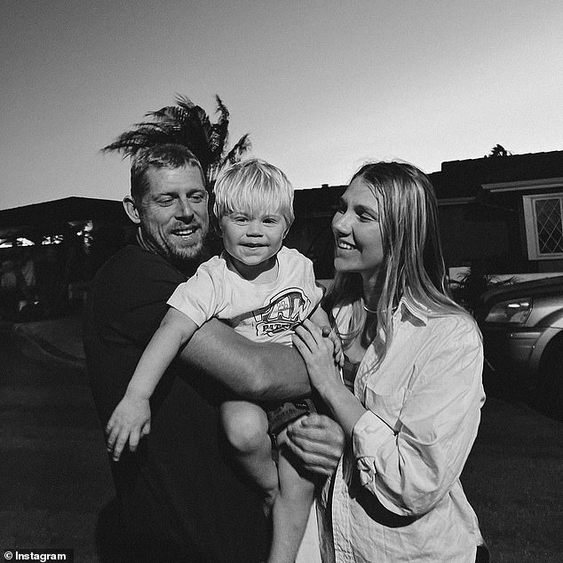 The surfing icon delighted fans in 2023 with the news that he and partner Breeana Randall (pictured with son Xander) are expecting their second child