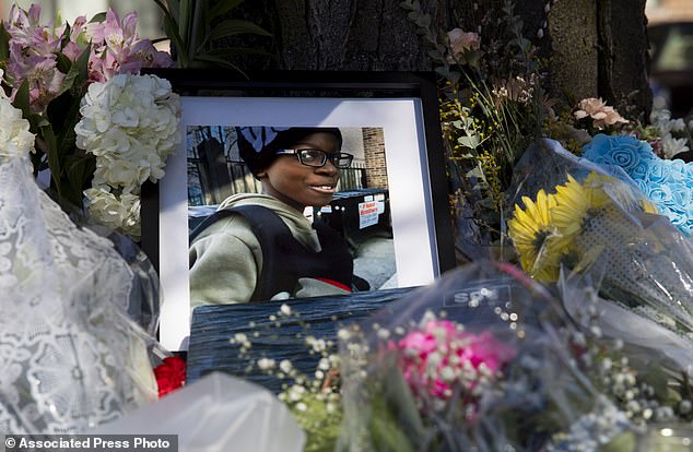 A photo of Jayden Perkins, an 11-year-old boy who was stabbed to death in his home, seen at a memorial outside Perkins' home in Chicago