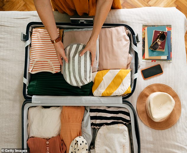 You see people packing only three tops, three pairs of pants and three pairs of shoes for their trip (stock image)