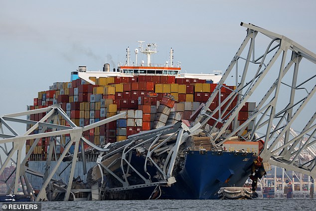 The mangled wreckage of the bridge wrapped around the front of the shipping container Dali