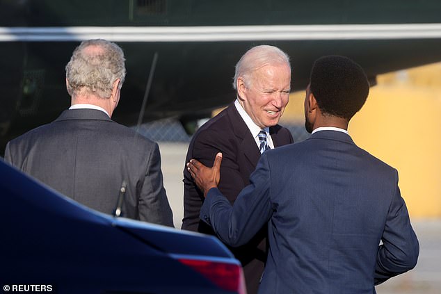 President Joe Biden is greeted by Scott at a 2021 event