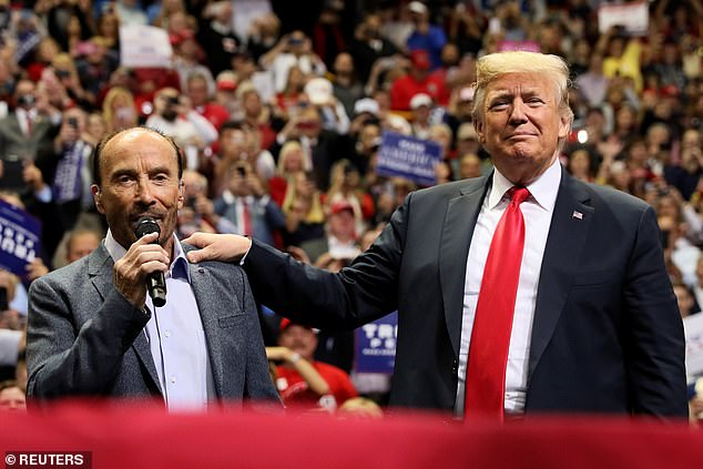 Donald Trump with country singer Lee Greenwood in November 2018 - Greenwood's song God Bless the USA is Trump's walk-on music for his political rally