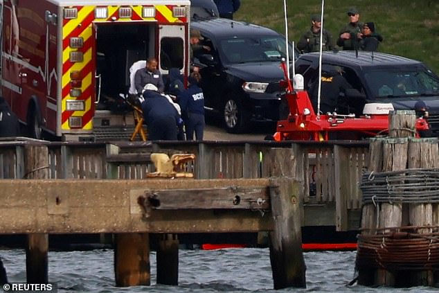 An injured person was pictured being loaded into an ambulance after being taken off the ship following the collapse