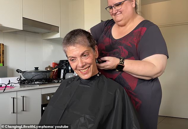 Ms Lovegrove documents her battle with cancer on her YouTube channel.  In one video she shares the moment her friend shaves her hair (photo)