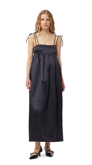 The dress in question from the luxury brand Ganni has adjustable satin tie cords