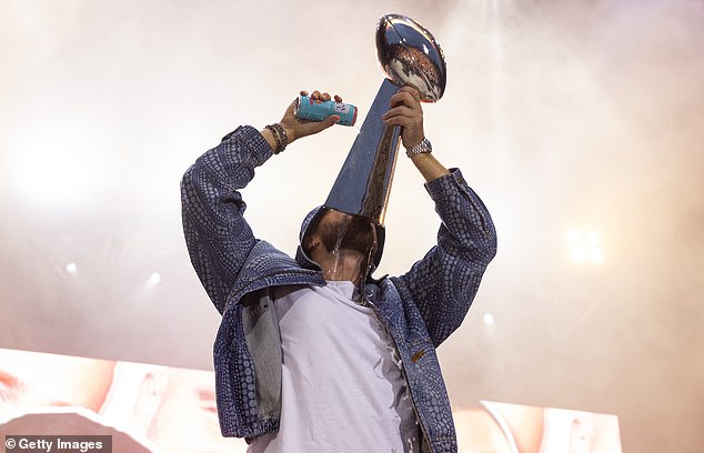 Three-time champion Travis drank a cocktail from a replica of the Lombardi Trophy in April 2023