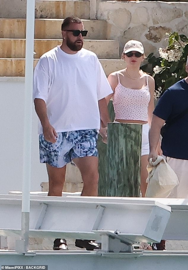 The singer and the NFL star, both 34, who were spotted sharing a passionate kiss on the beach last week, were madly in love as they walked to a boat ahead of a day of sightseeing