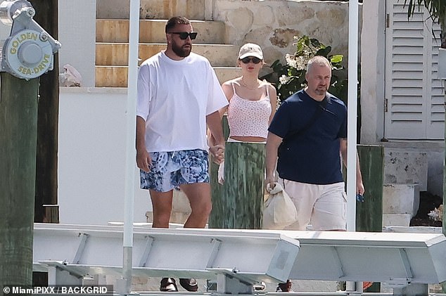 Travis showed off his own fashion flair in a loose white T-shirt and patterned shorts