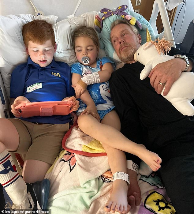 Gunnar also shared a photo of his young son lying in the hospital bed with him and Monroe