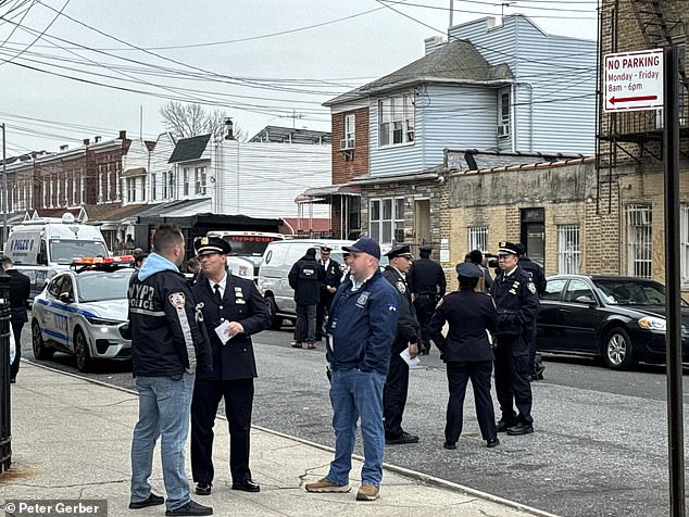 In a video posted to the app, about 20 NYPD officers can be seen guarding the outside of the school