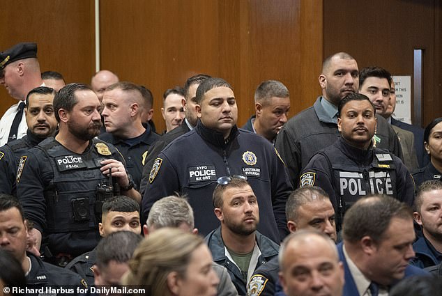 Hundreds of NYPD officers descended on the Queens courthouse on Wednesday to attend the arraignment