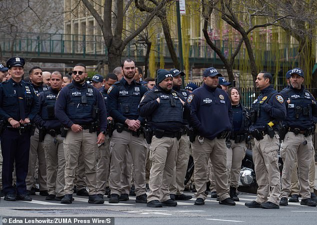 Officers from the NYPD Community Response Team of which Officer Jonathan Diller was a member arrive outside the Chief Medical Examiner's office on E. 30th Street for the dignified transfer of Officer Diller