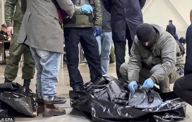 Russian investigators worked in the concert hall of Crocus City Hall after the terrorist attack