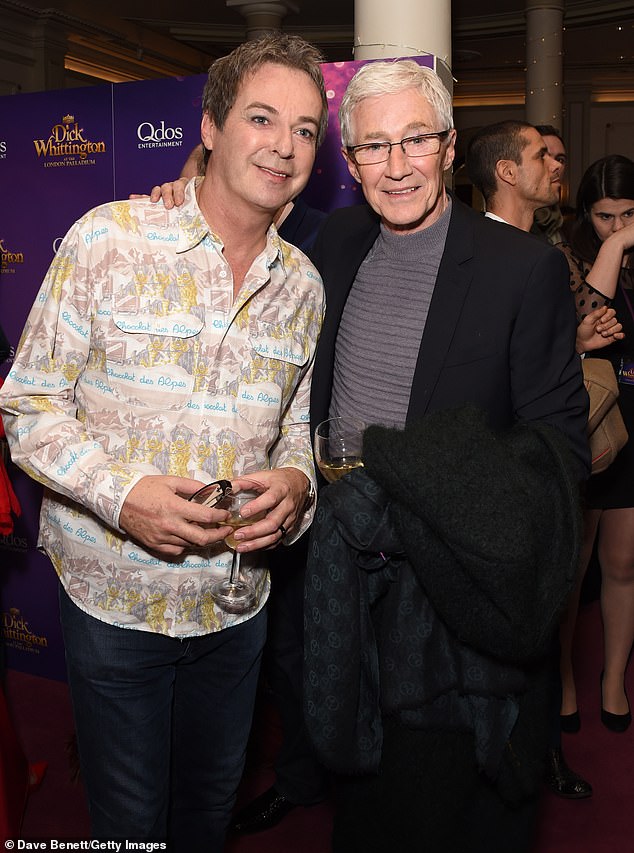 Paul's friend Julian Clary recently said he was 'full of natural kindness and random generosity' (pictured together in 2017)