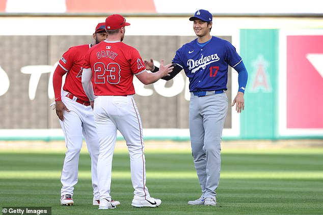 Ohtani chats with his ex-Los Angeles Angels teammates during his return to Anaheim on Tuesday