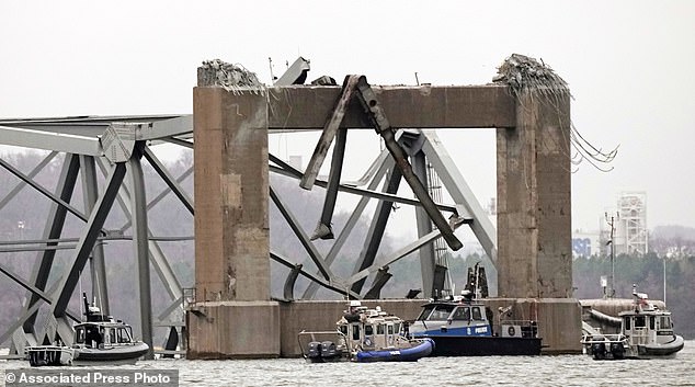 Police dive boats are working around part of the structure of the Francis Scott Key Bridge after the ship struck the bridge on Wednesday