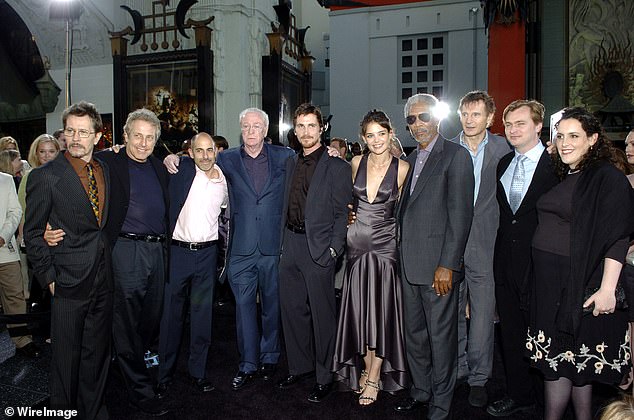 The couple is pictured at the Batman Begins Los Angeles Premiere with, from left, Gary Oldman, Charles Roven, producer, Warner Bros' Jeff Robinov, Michael Caine, Christian Bale, Katie Holms, Morgan Freeman, Liam Neeson, Christopher Nolan , director and Emma Thomas