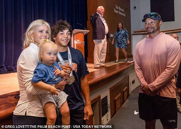 Woods and Nordegren reunited Monday during son Charlie's golf championship ceremony