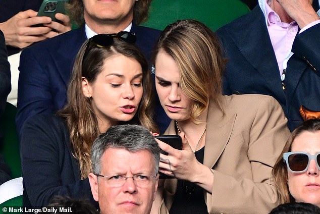 Cara Delevingne pictured with Sienna Miller at Wimbledon in 2023