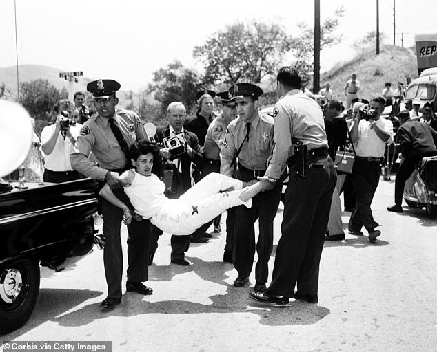 Los Angeles sheriff's deputies photographed Chavez Ravine resident Aurora Vargas being forcibly removed from her home in 1959, the same year the stadium was built