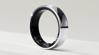 The Samsung Galaxy Ring lies on a pale surface