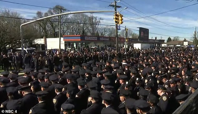 Thousands of police officers from across the country line the streets for Diller's funeral procession