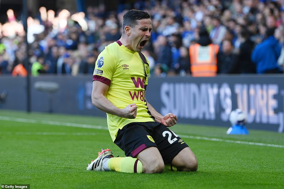 Burnley's Josh Cullen celebrates after leveling the visitors two minutes into the second half at Stamford Bridge