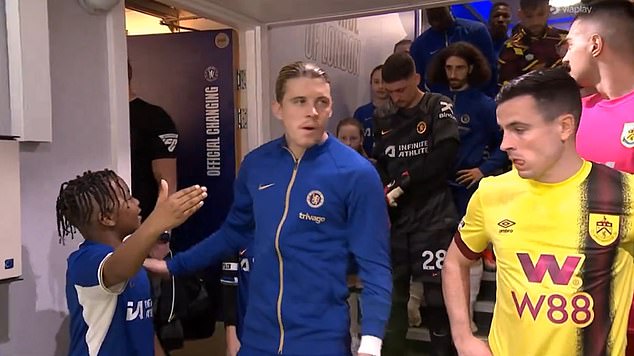 The England midfielder missed the youngster's outstretched hand as he walked through the tunnel