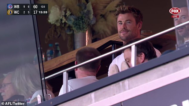 The Australian actor sat upright in a private stand and in a video shared by an official AFL social media page, Hemsworth appeared involved in the match.  When he saw the camera, Chris waved and appeared to shout 