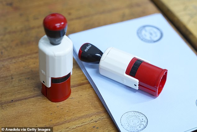 Citizens cast their votes for the municipal elections at a polling station in Istanbul