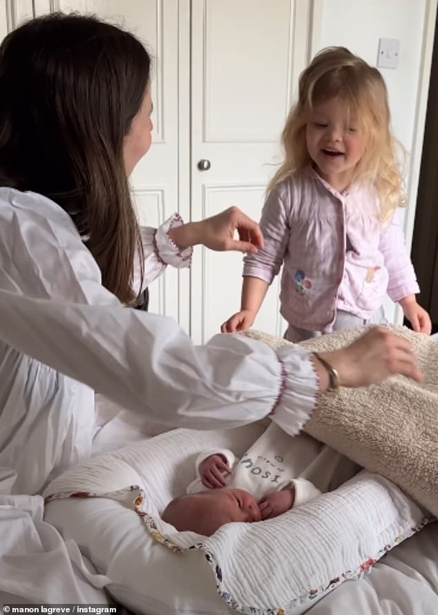 The sweet video showed the toddler excited to meet her brother or sister as she climbed onto the bed to cuddle him