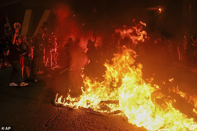 Crowds set fires as they call on Prime Minister Benjamin Netanyahu to resign from office