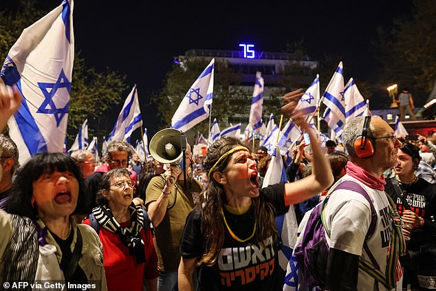 Demonstrators shout slogans into megaphones during protests in Jerusalem on Sunday