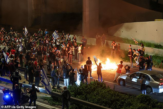 Protesters demanding the safe release of hostages set fires and block a major road in Jerusalem