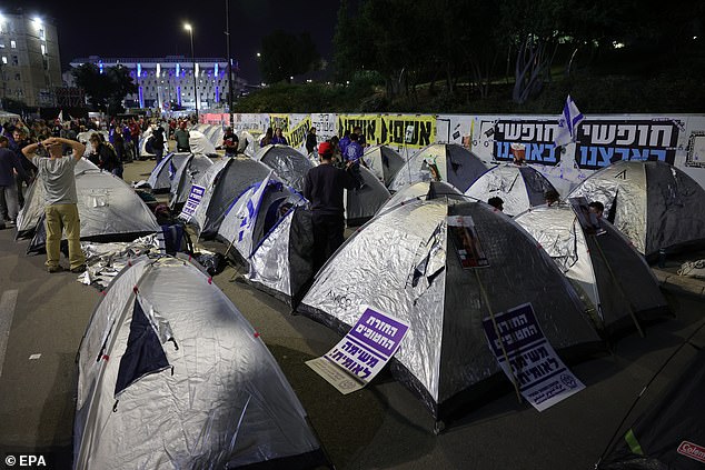 Protesters set up camping tents during Sunday's protest in Jerusalem