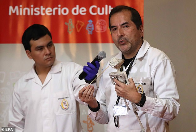 Flavio Estrada (right), forensic archaeologist from the Institute of Legal Medicine and Forensic Sciences of Lima of the Public Prosecutor's Office