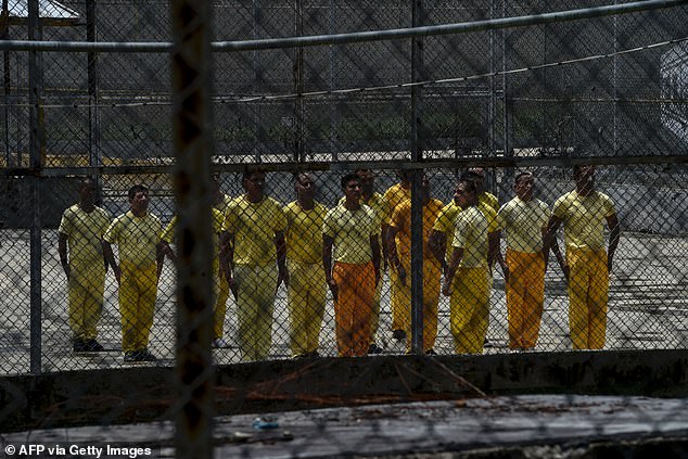 Prisoners receive military training in part of the El Rodeo prison near Caracas on July 1, 2016