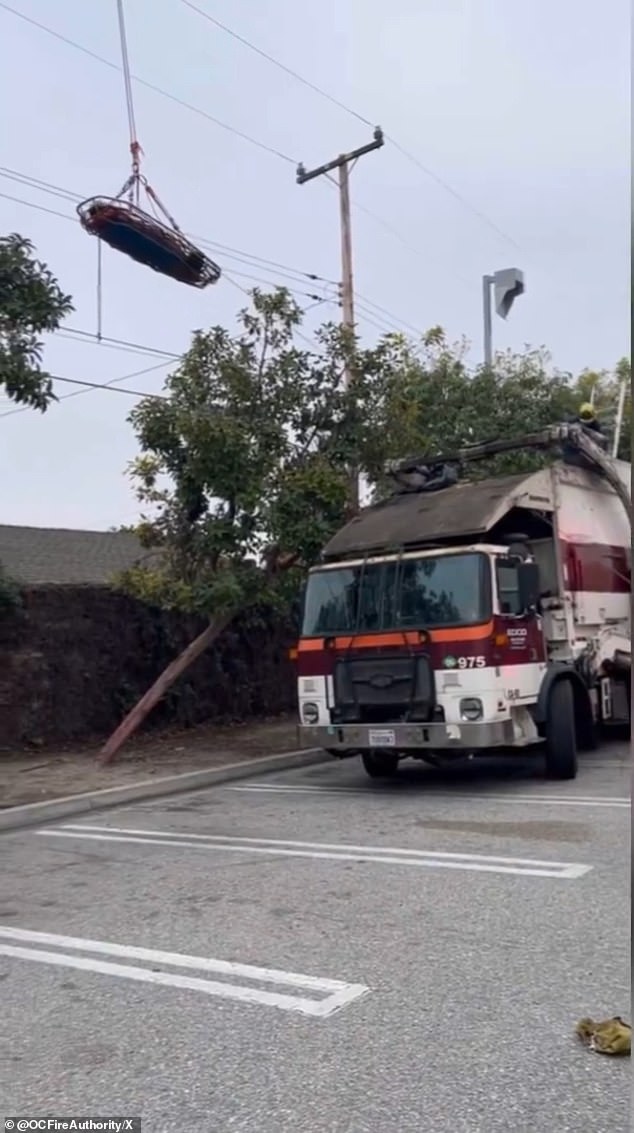 Video footage revealed the moment a California woman was airlifted to hospital after being crushed in a dumpster as the trash bin she was sleeping in was emptied