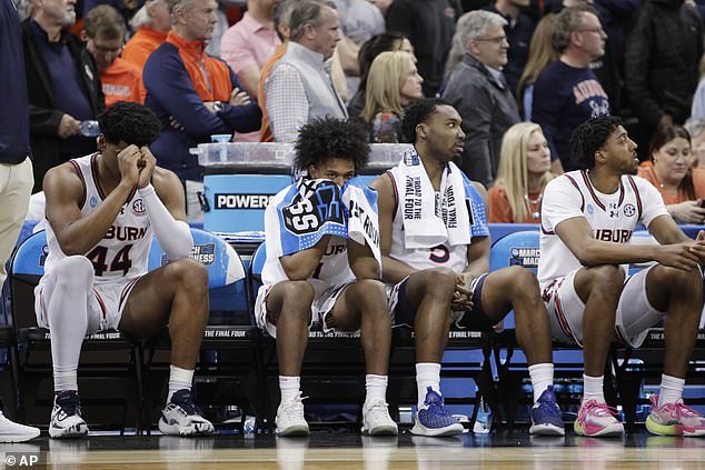 Auburn bench players react to a first-round loss to Yale near the end of the second half