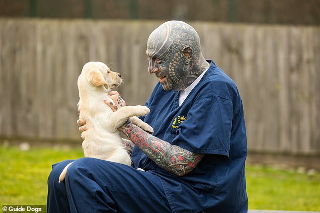 Guide dogs are calling on people with beards, tattoos, piercings and other 'distinguishing marks' to help train the next generation of guide dogs